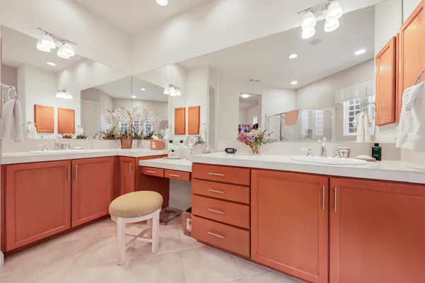 a view of walk in closet with clothes