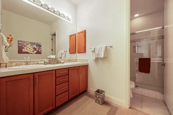 a front view of a house with plants