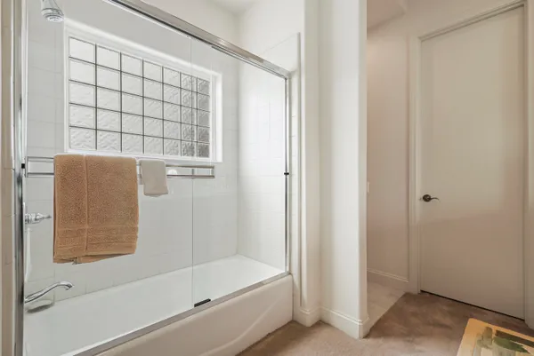 a view of swimming pool with outdoor seating and lake view