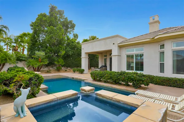 a front view of a house with swimming pool