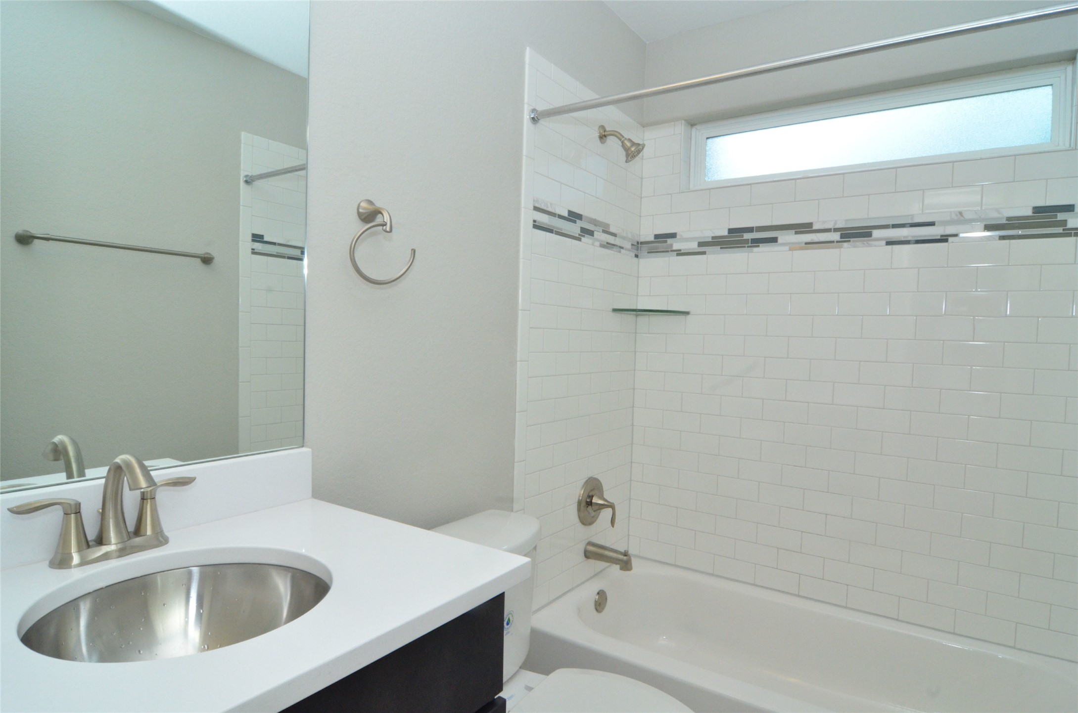 1916 Cleese Drive Austin, TX 78741 - Photo 21 of 36 Refined bathroom with subway tile shower and contemporary vanity.