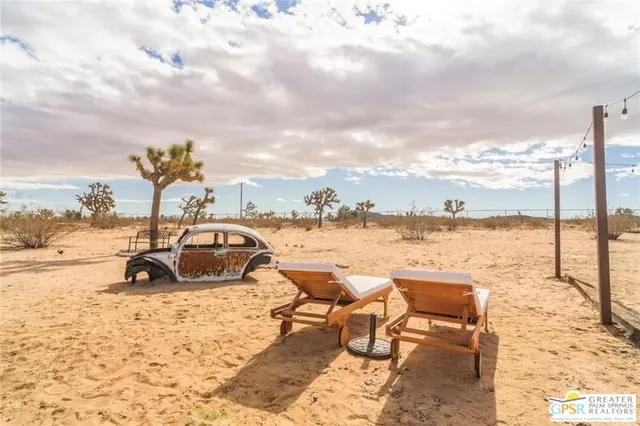 a view of a patio with chairs and tables