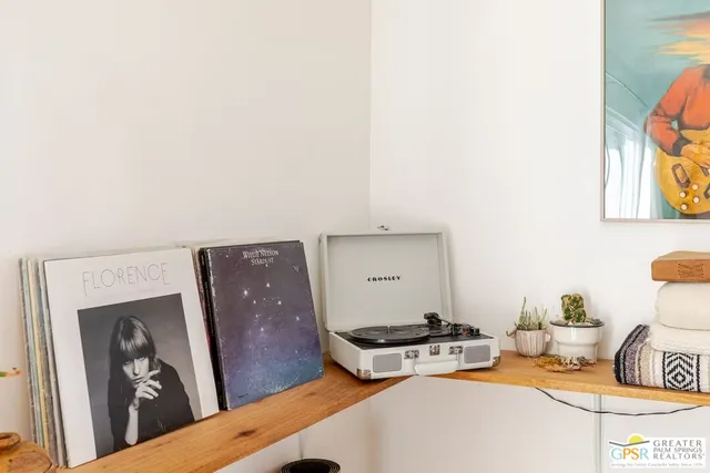 a bathroom with a granite countertop sink a mirror and shower
