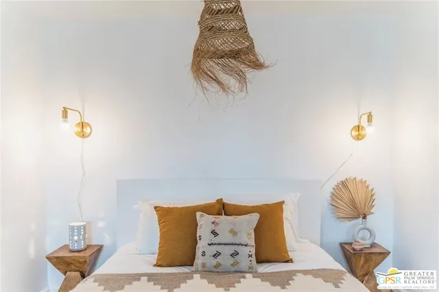 a bedroom with two beds and painted walls