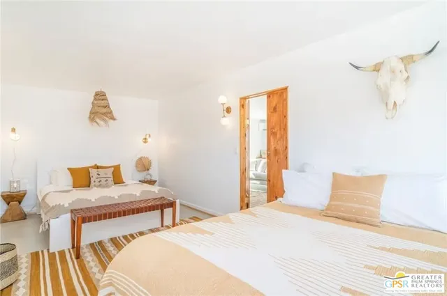 a living room with furniture and flowers