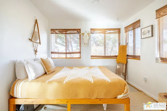 a bedroom with a bed and a table