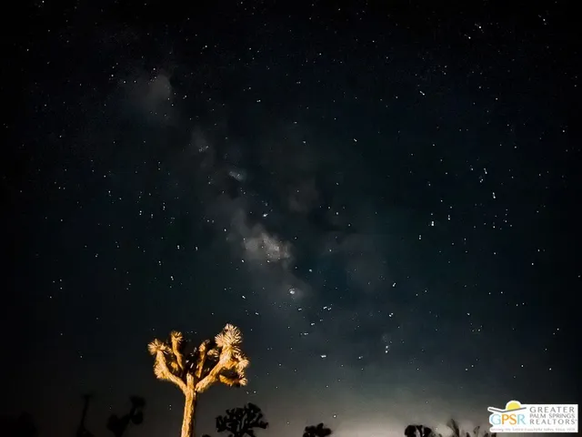 a backyard of a house with lots of lights