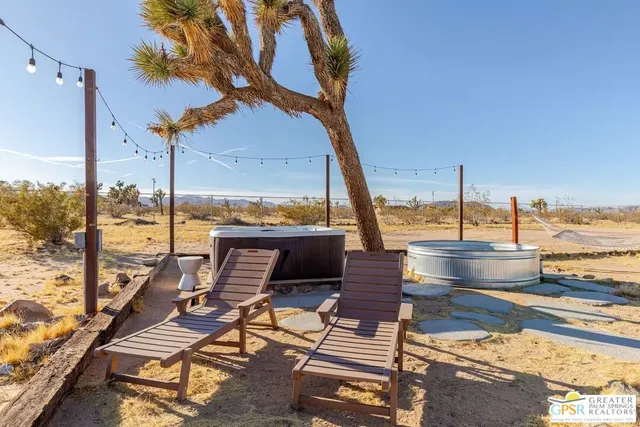a view of a terrace with wooden benches