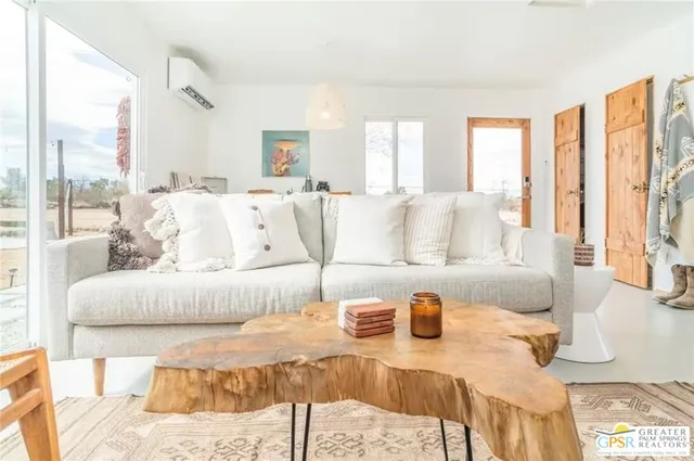 a view of a kitchen with a sink and wooden floor