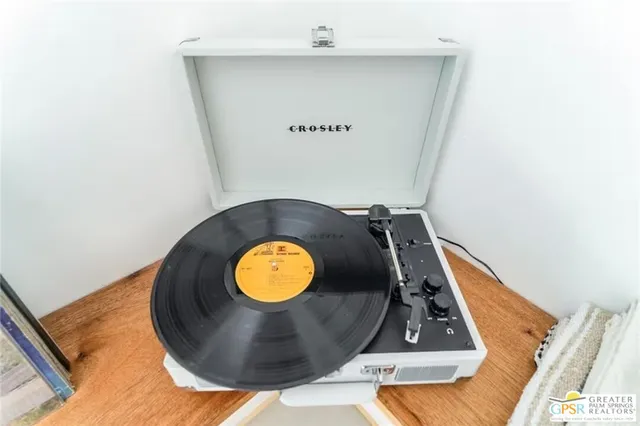 a kitchen with a stove and a wooden floor