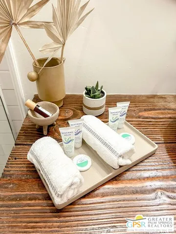 a bathroom with a sink mirror and vanity