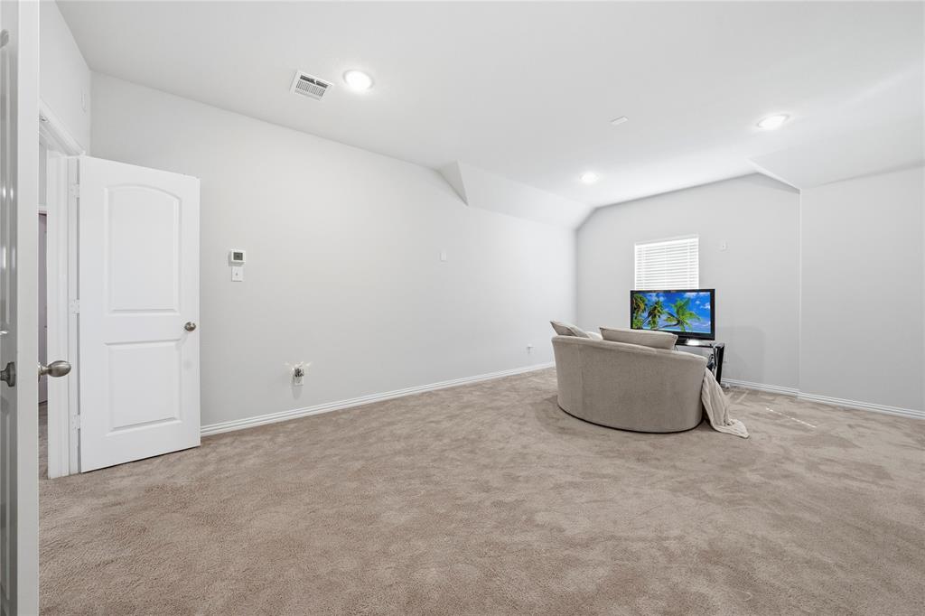 4542 Kipling Avenue Aubrey, TX 76227 - Photo 21 of 34 a living room with a couch
