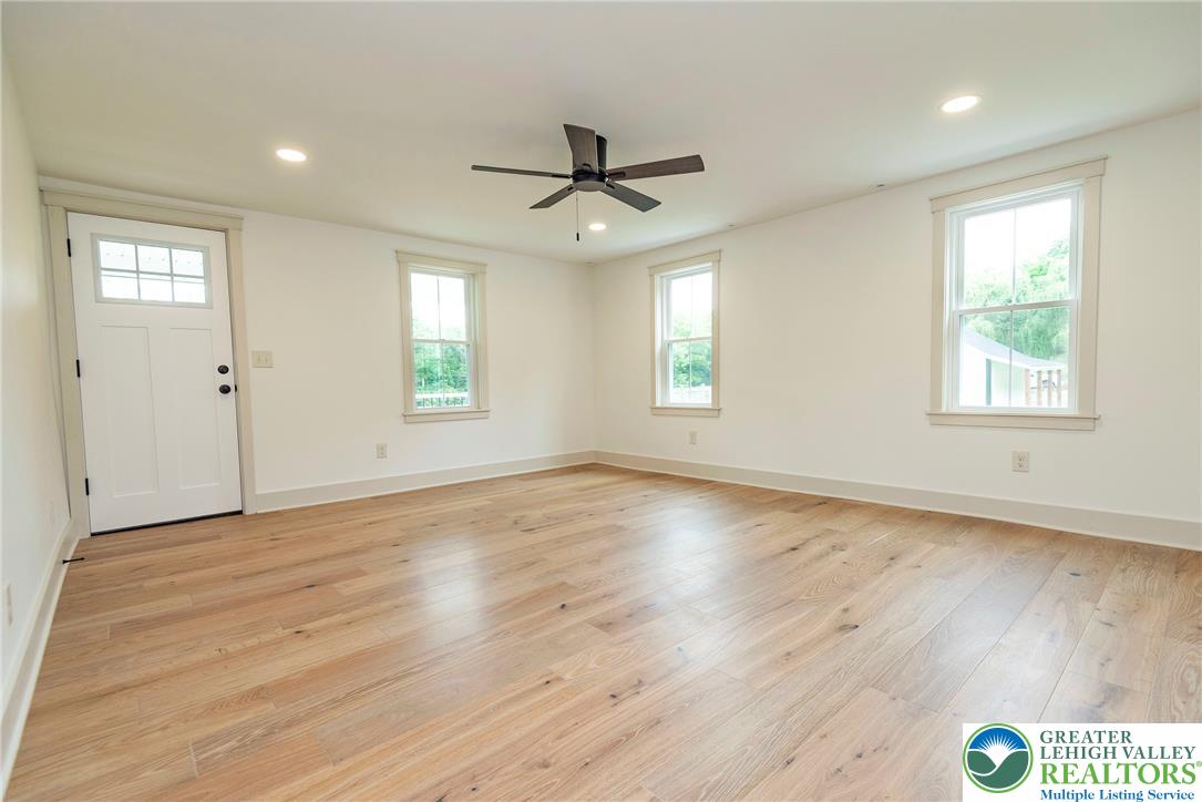 72 Allegheny Road Mount Bethel, PA 18343 - Photo 21 of 72 Hardwood floors and bright windows illuminate this spacious, versatile room.