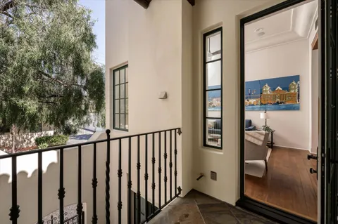 a view of a balcony from a hallway