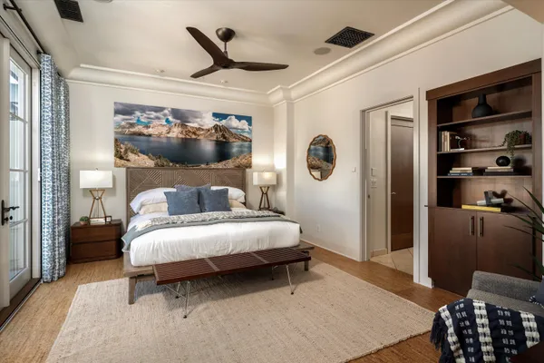 a bedroom with a large bed and a large window