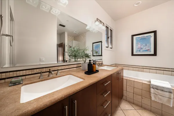 a bathroom with a tub and shower