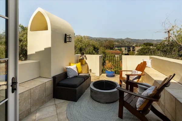 a spacious bedroom with a bed and glass door