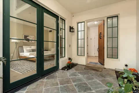 a view of a room with a glass door