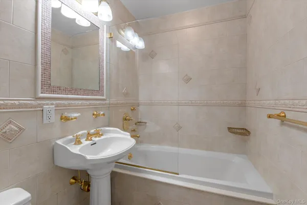 a bathroom with a sink and mirror