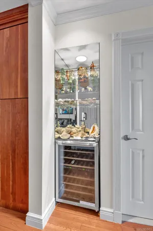 a view of open kitchen with wooden floor and a fireplace