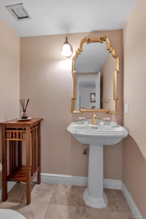 a bathroom with a sink a mirror and vanity