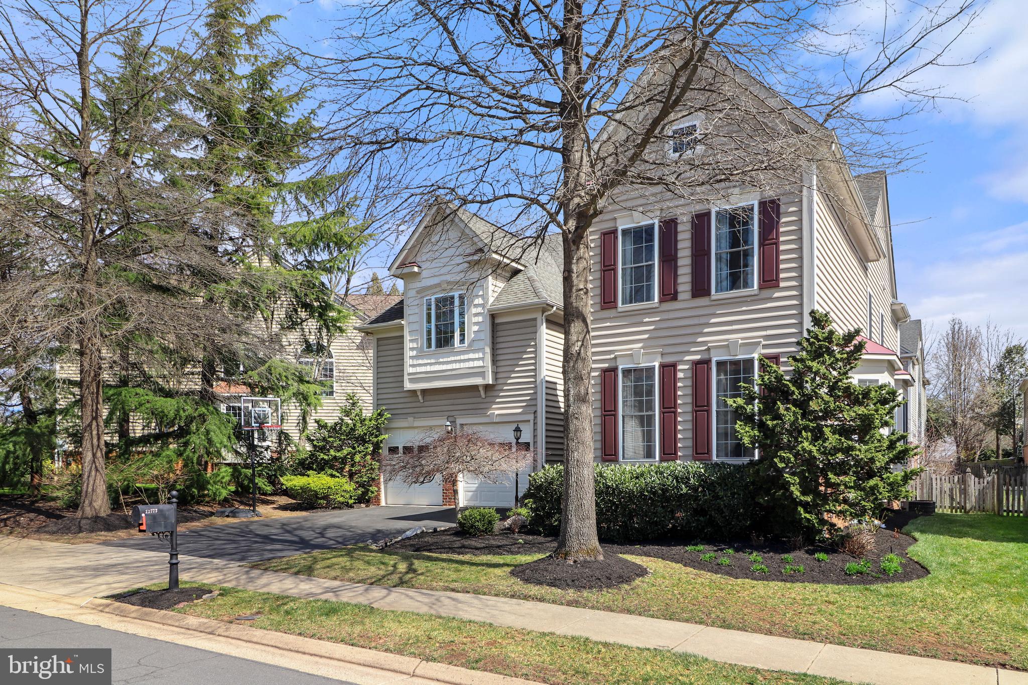 22773 Highcrest Circle Brambleton, VA 20148 - Photo 2 of 40 a front view of a house with garden