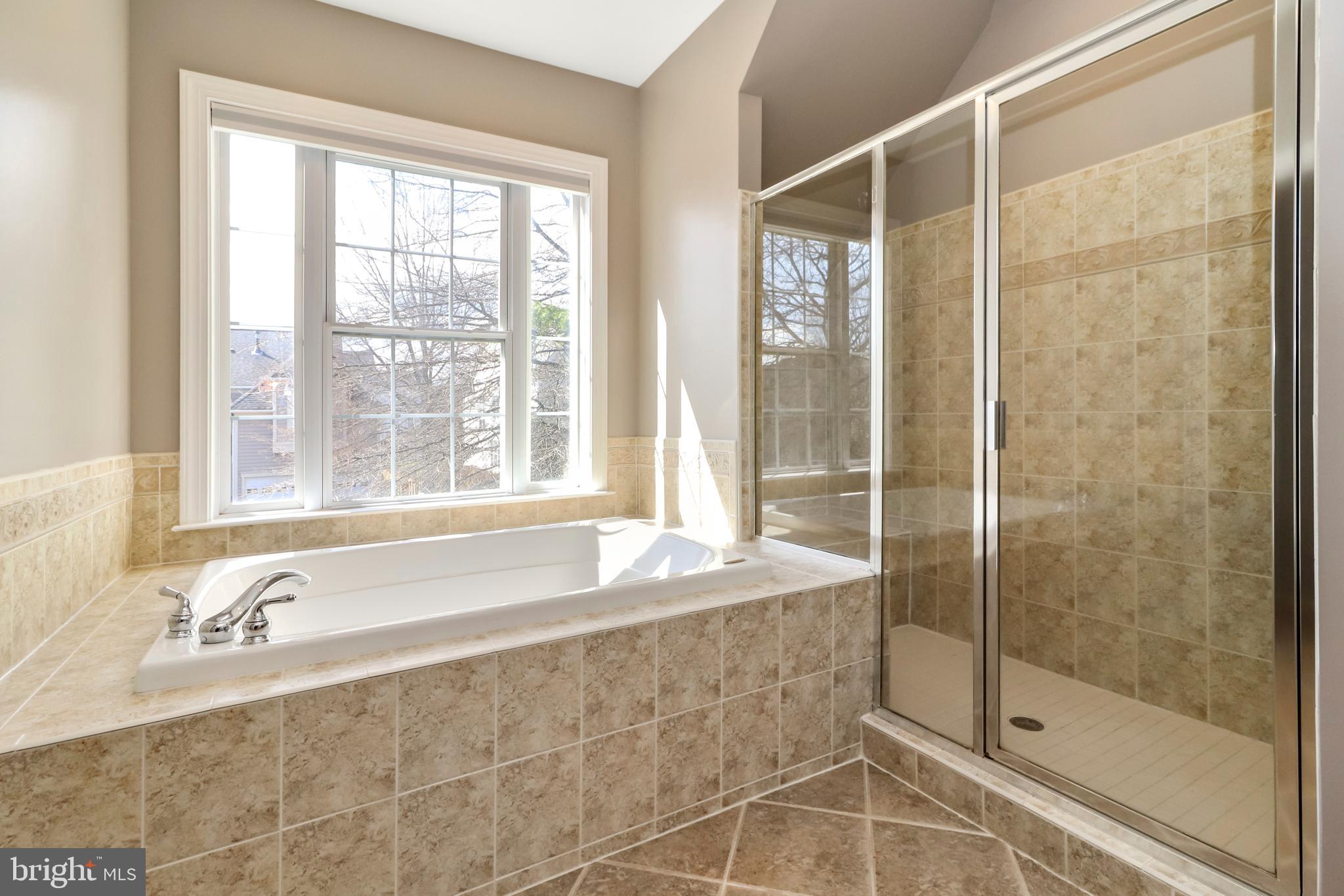 22773 Highcrest Circle Brambleton, VA 20148 - Photo 21 of 40 a bathroom with a granite countertop sink and a bathtub