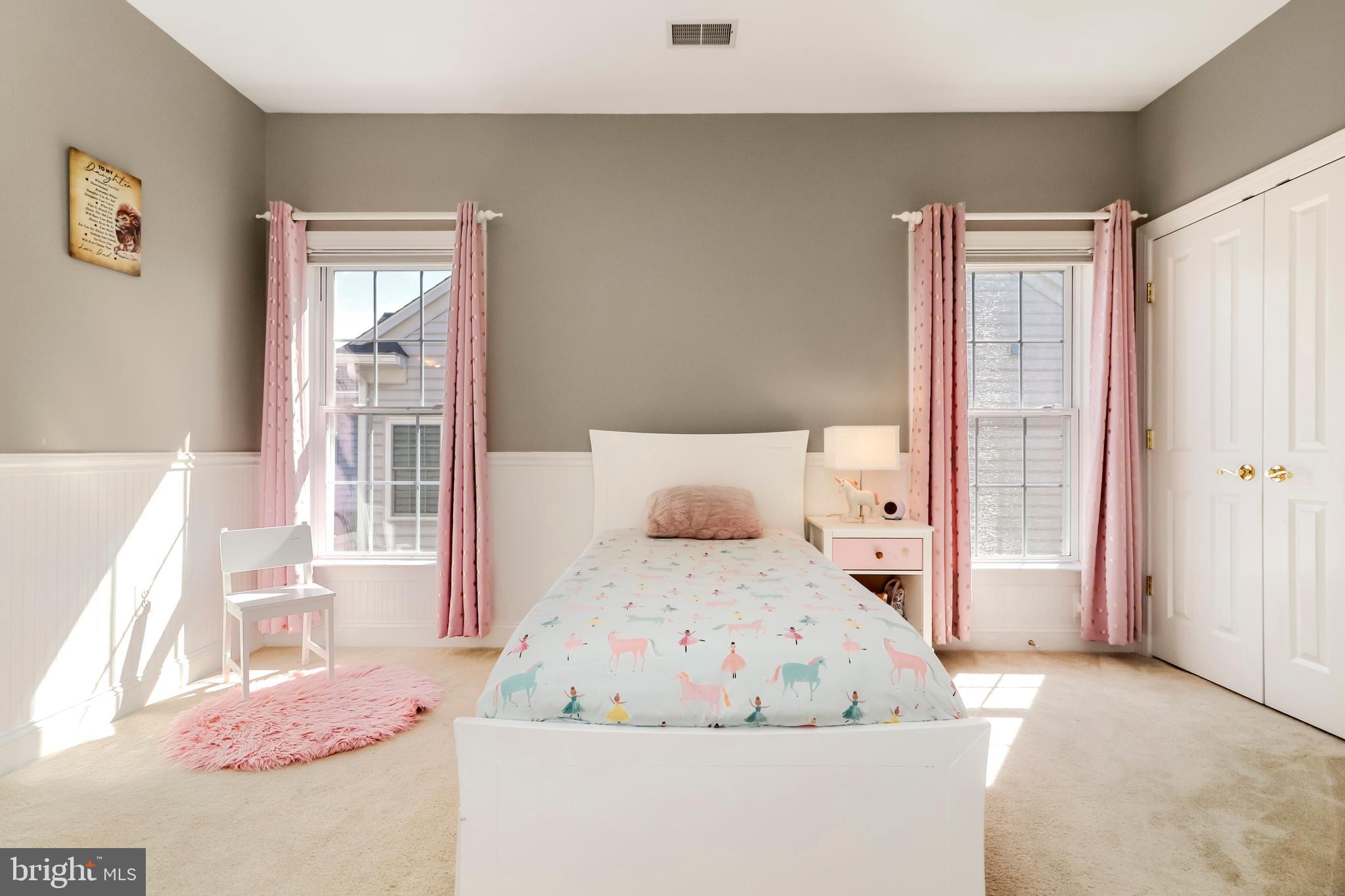 22773 Highcrest Circle Brambleton, VA 20148 - Photo 25 of 40 a bedroom with a bed and wooden floor