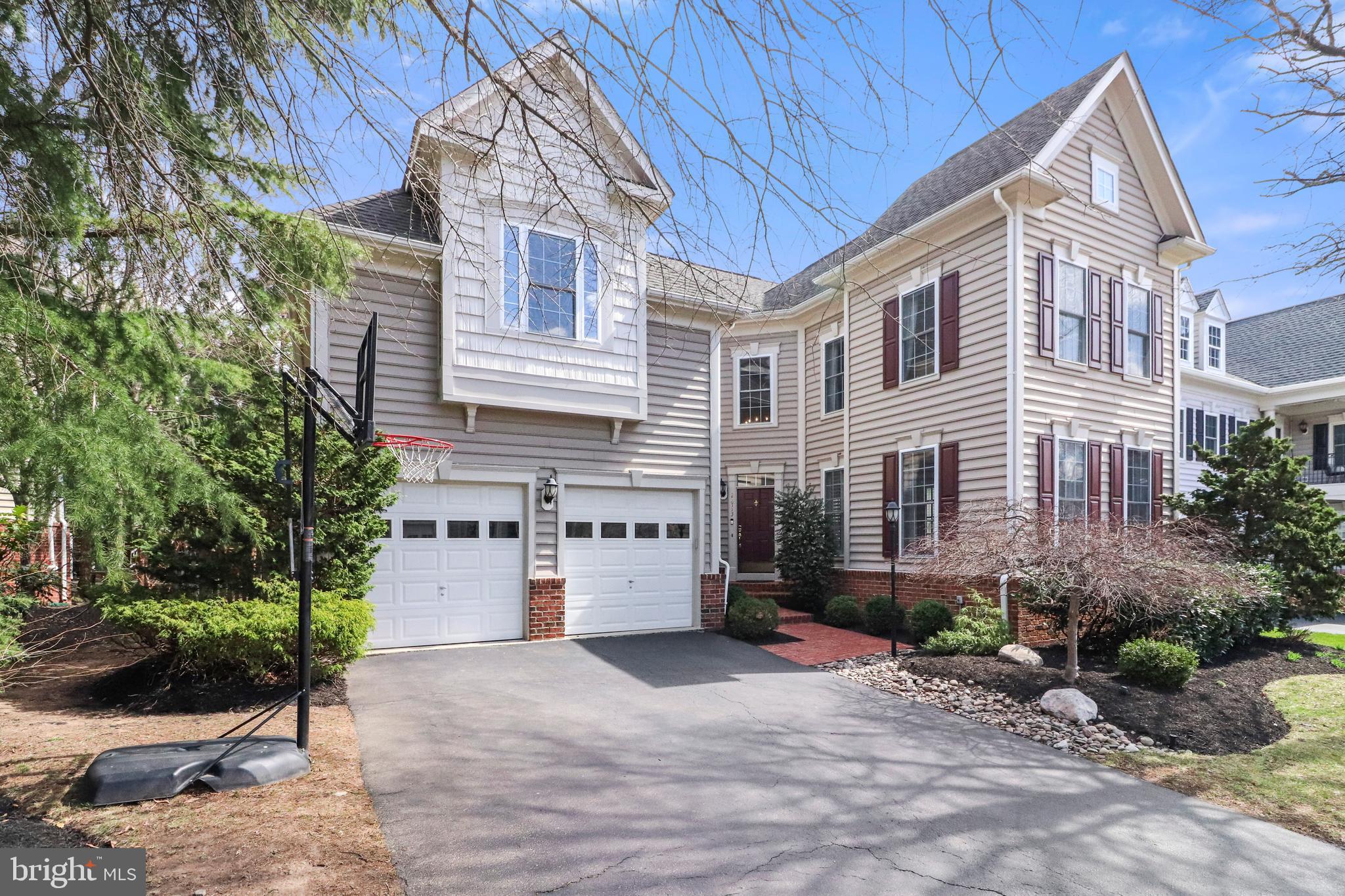 22773 Highcrest Circle Brambleton, VA 20148 - Photo 3 of 40 a front view of a house with a yard
