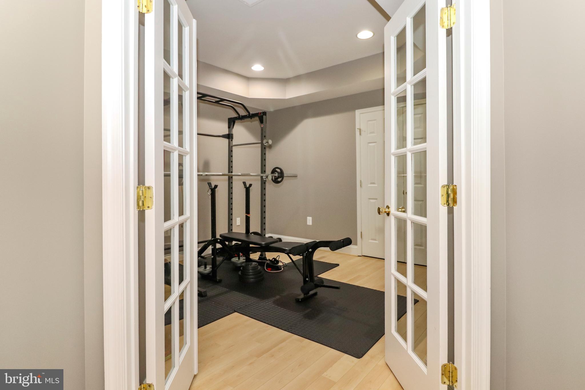 22773 Highcrest Circle Brambleton, VA 20148 - Photo 31 of 40 a bathroom with a glass shower door