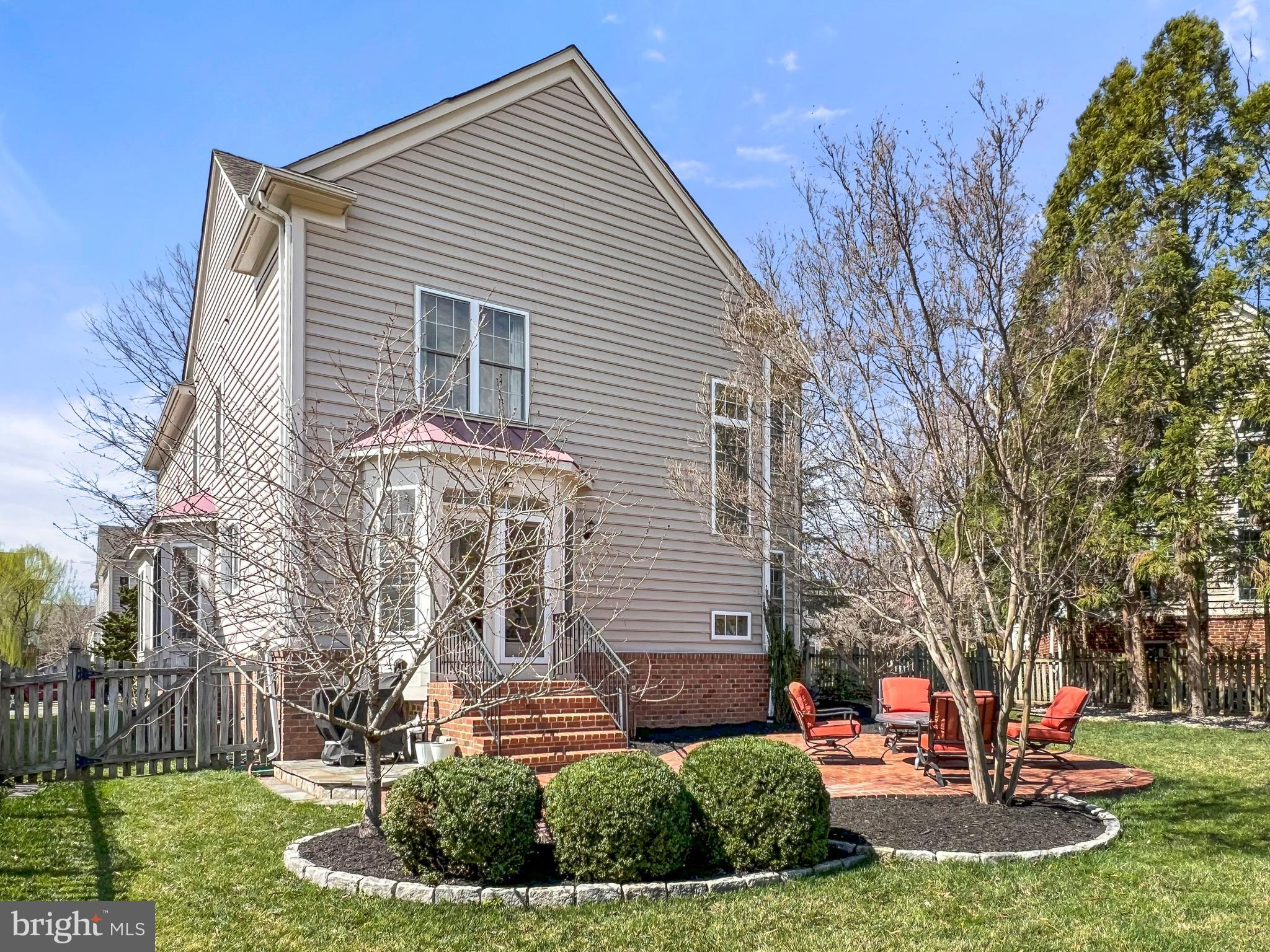 22773 Highcrest Circle Brambleton, VA 20148 - Photo 34 of 40 a front view of a house with a yard
