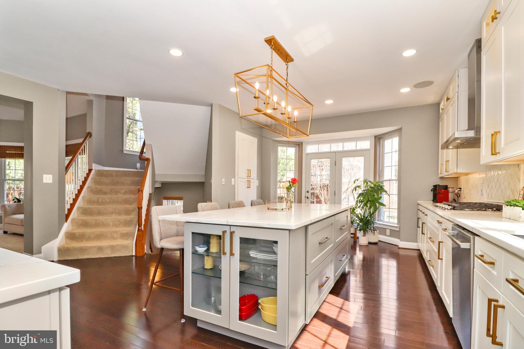 22773 Highcrest Circle Brambleton, VA 20148 - Photo 8 of 40 a kitchen with counter top space and wooden floor
