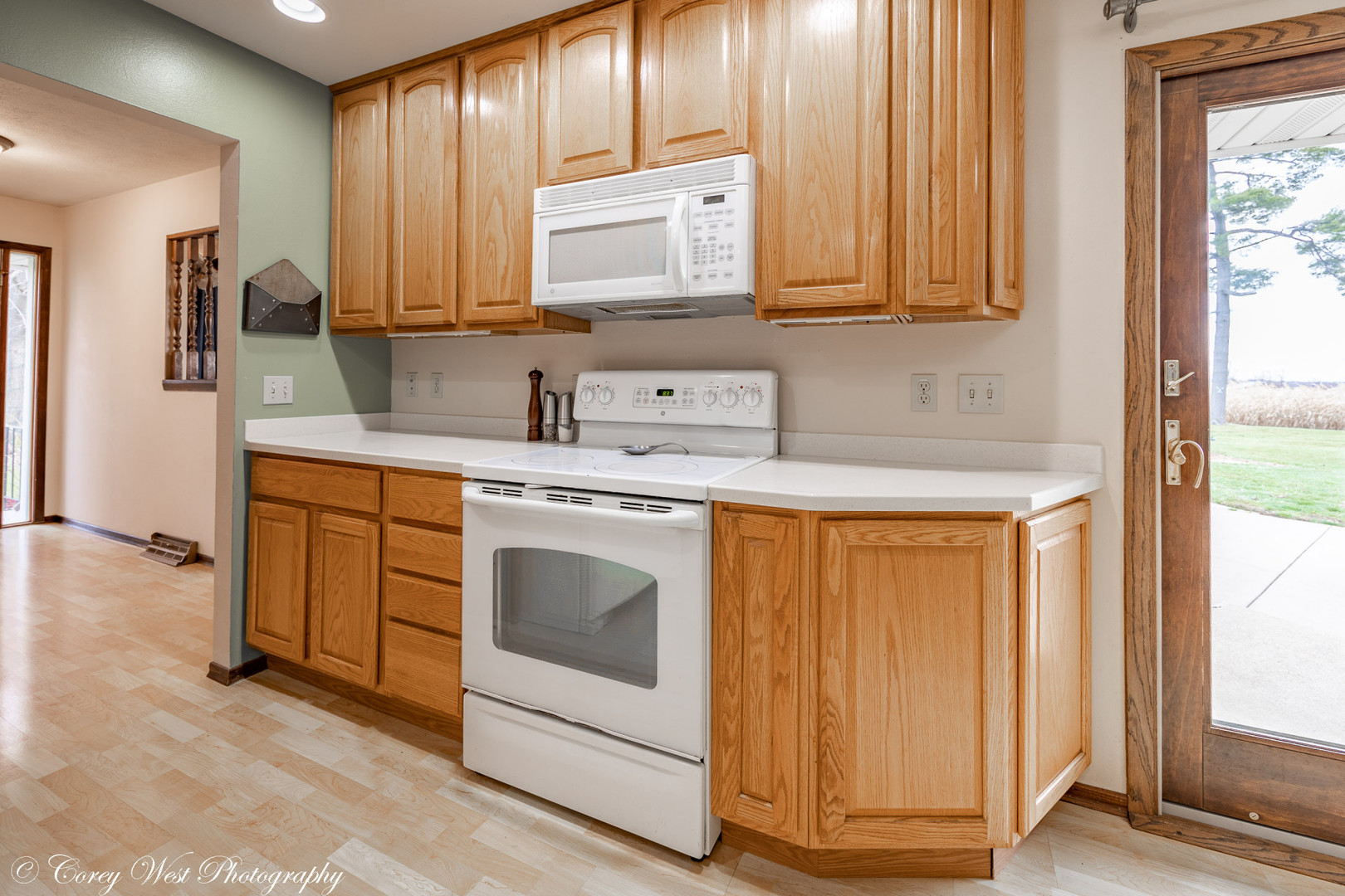6790 Cherry Valley Road Kingston, IL 60145 - Photo 13 of 44 a kitchen with stainless steel appliances granite countertop a stove a sink and a microwave
