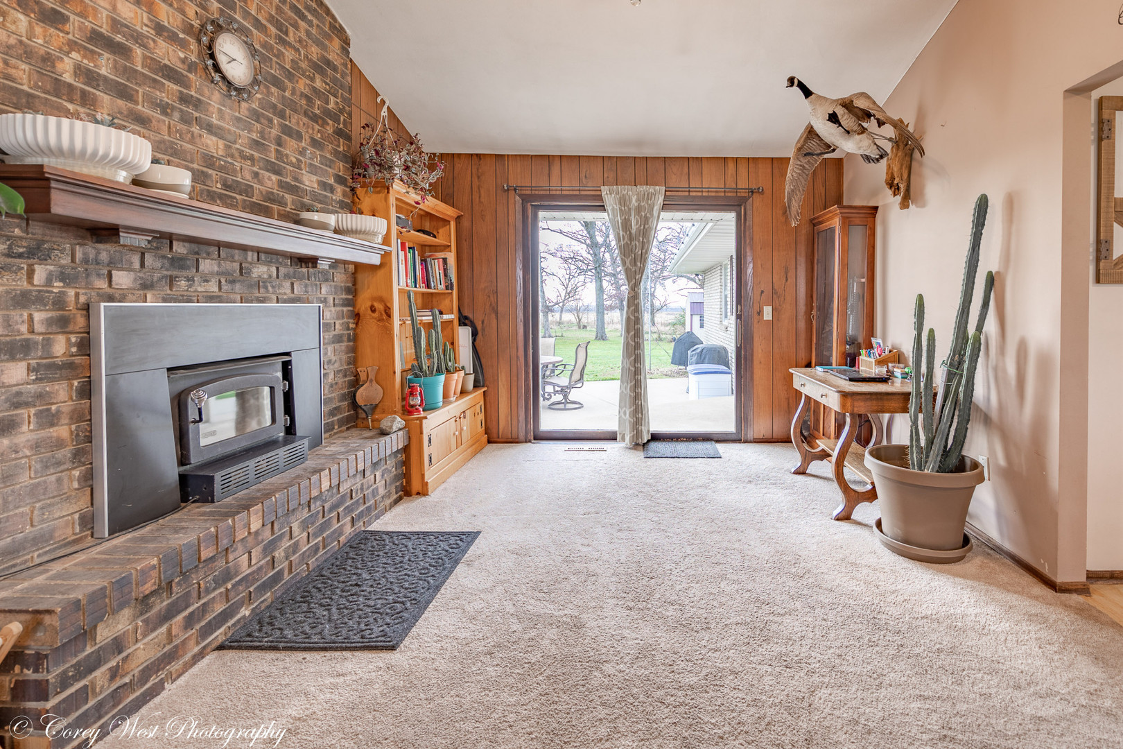 6790 Cherry Valley Road Kingston, IL 60145 - Photo 18 of 44 a view of a livingroom with furniture and a fireplace