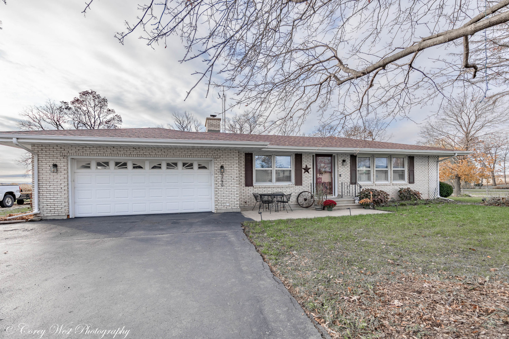 6790 Cherry Valley Road Kingston, IL 60145 - Photo 2 of 44 a view of a house with a yard and large tree