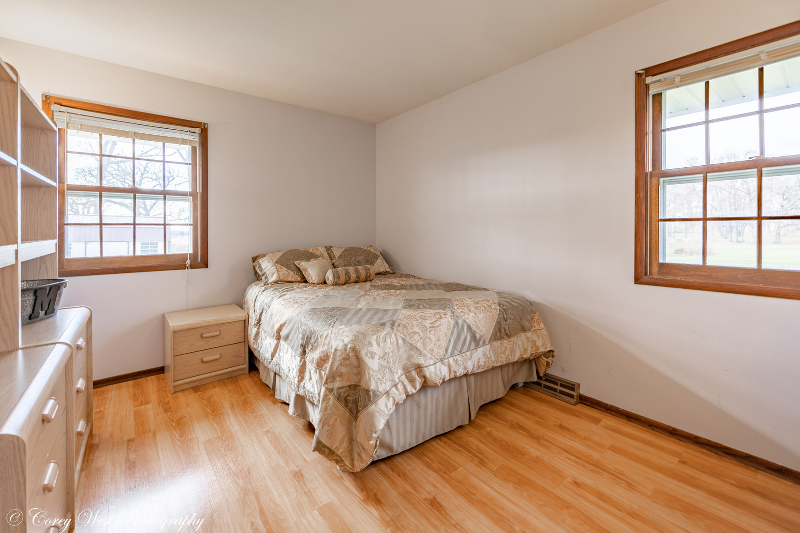 6790 Cherry Valley Road Kingston, IL 60145 - Photo 23 of 44 a bedroom with a bed and wooden floor