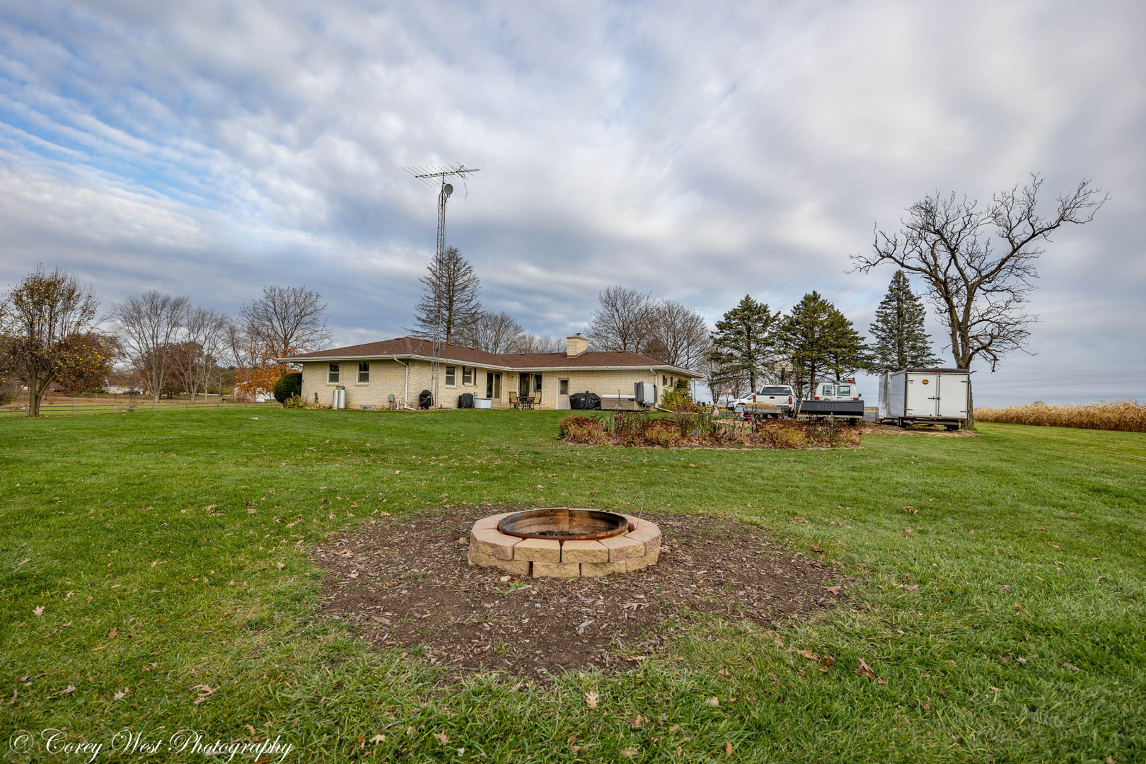 6790 Cherry Valley Road Kingston, IL 60145 - Photo 32 of 44 a view of a garden with a house in the background