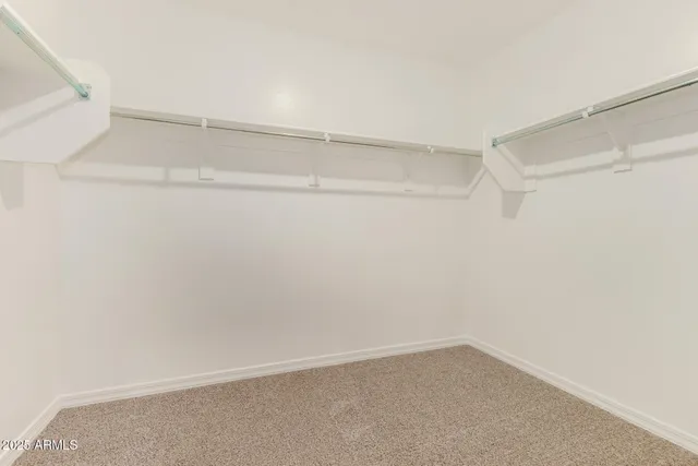 a view of an empty walk in closet