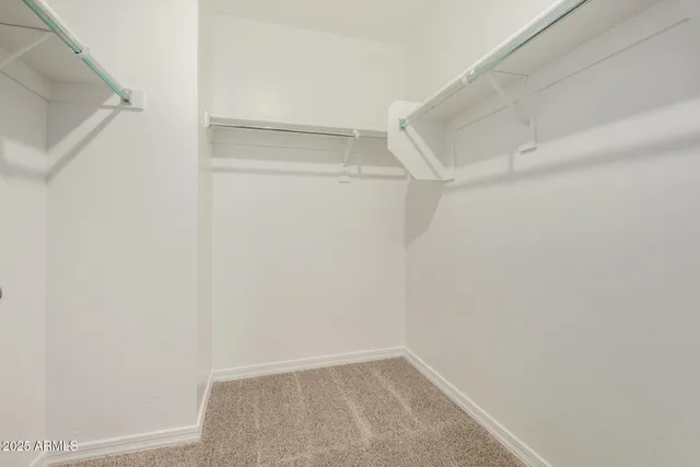 a view of an empty walk in closet