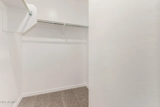 a view of an empty walk in closet