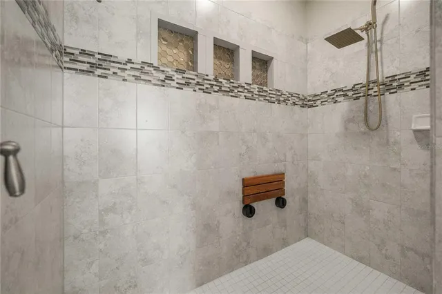 a bathroom with white cabinets