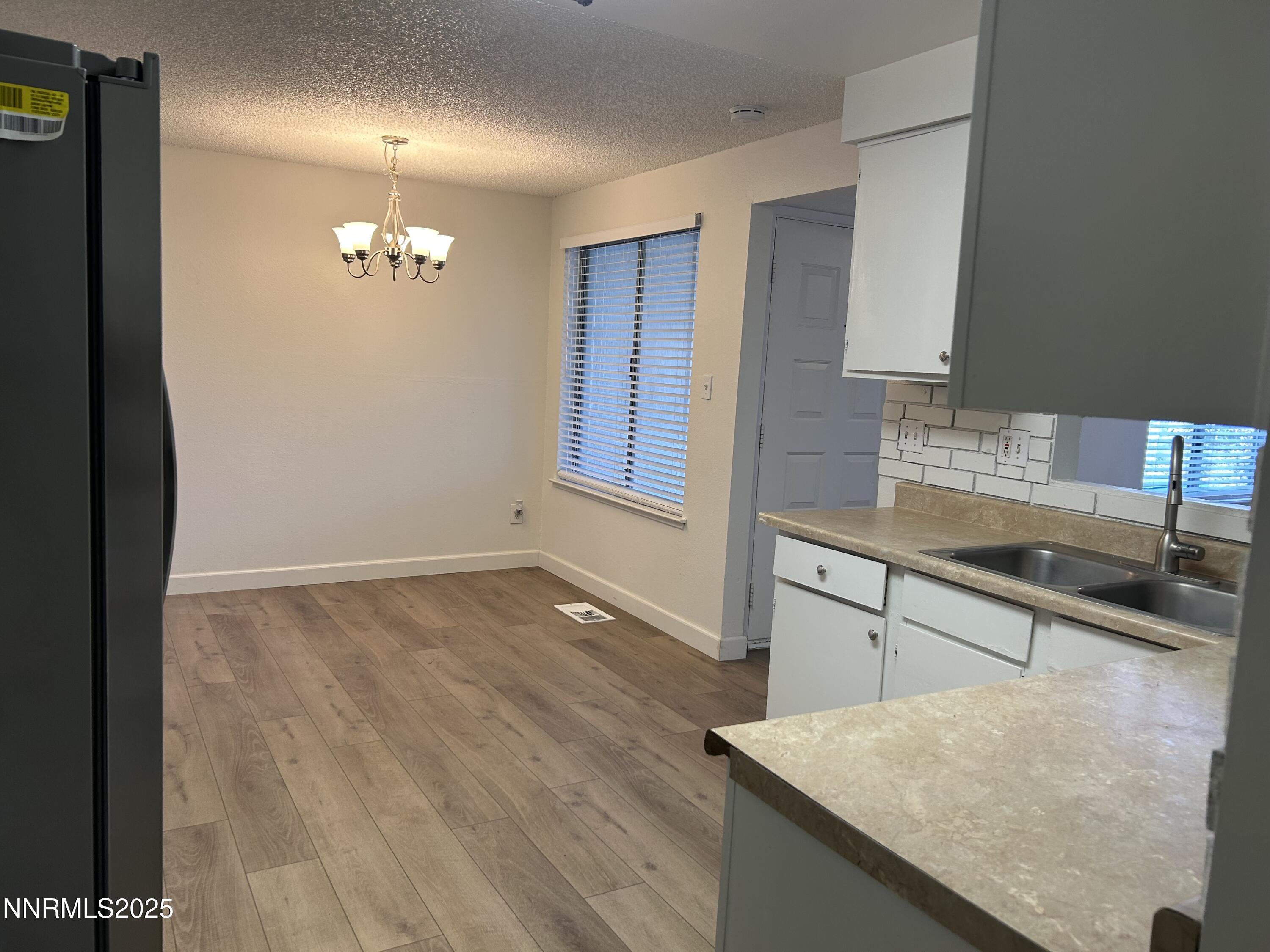 6780 Peppermint Drive Reno, NV 89506 - Photo 3 of 16 a view of a kitchen from the hallway