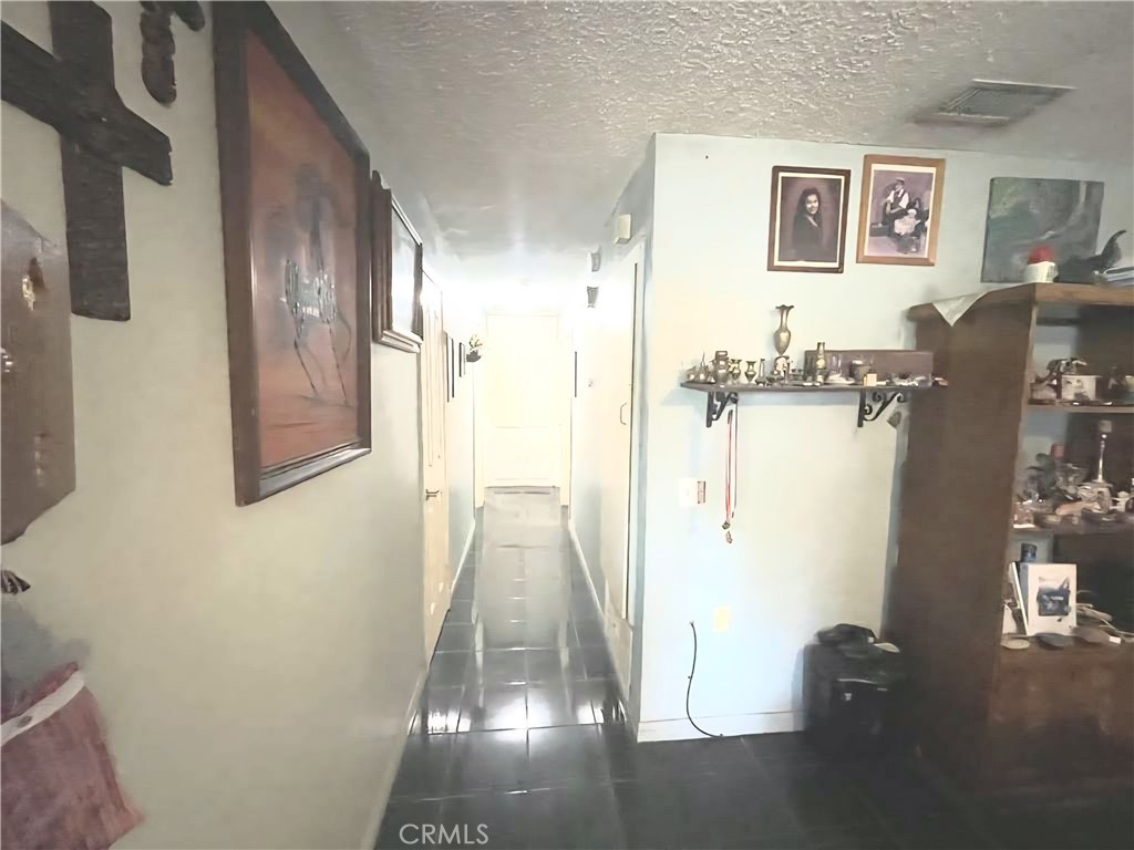 4267 Baggett Drive Riverside, CA 92505 - Photo 17 of 28 a view of a hallway with wooden floor and closet
