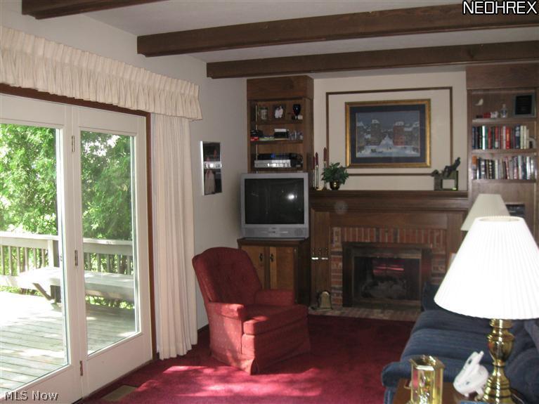 8908 Shepard Road Macedonia, OH 44056 - Photo 4 of 25 Family room with fireplace and built-in bookcases.