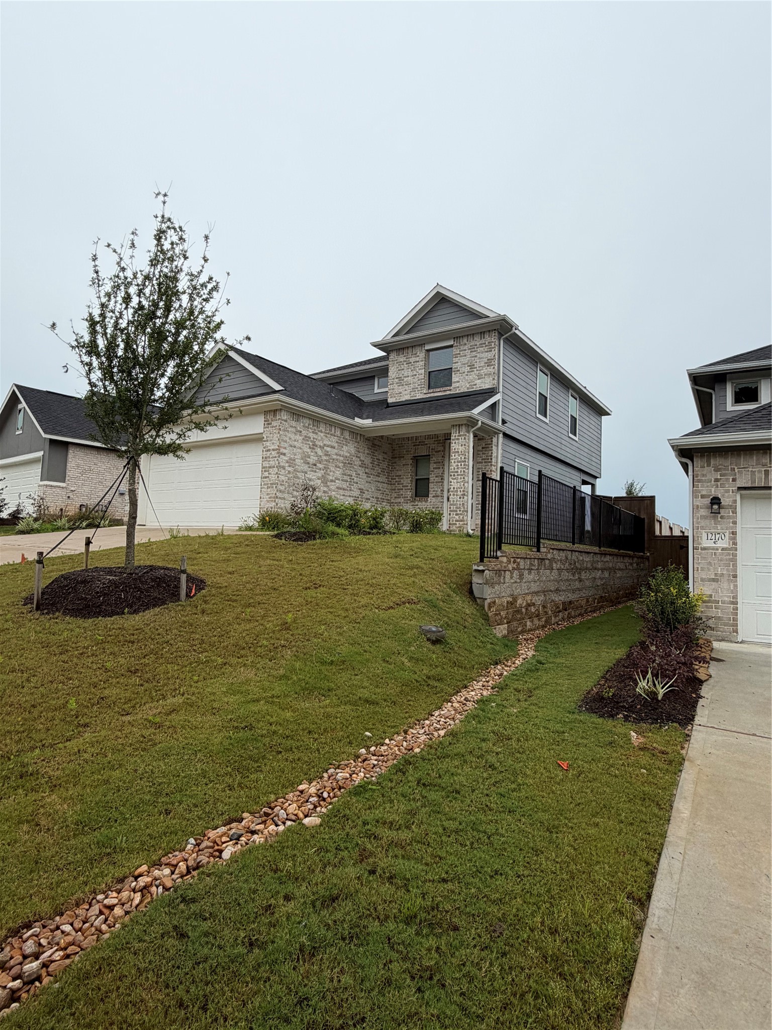 12176 Ridge Top Drive Conroe, TX 77304 - Photo 1 of 31 Beautiful new iron fence and home next door is completely build!