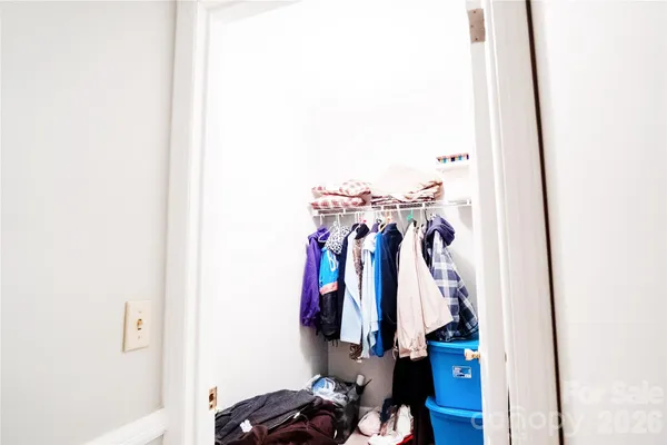 a bathroom with a sink a toilet a mirror and a shower