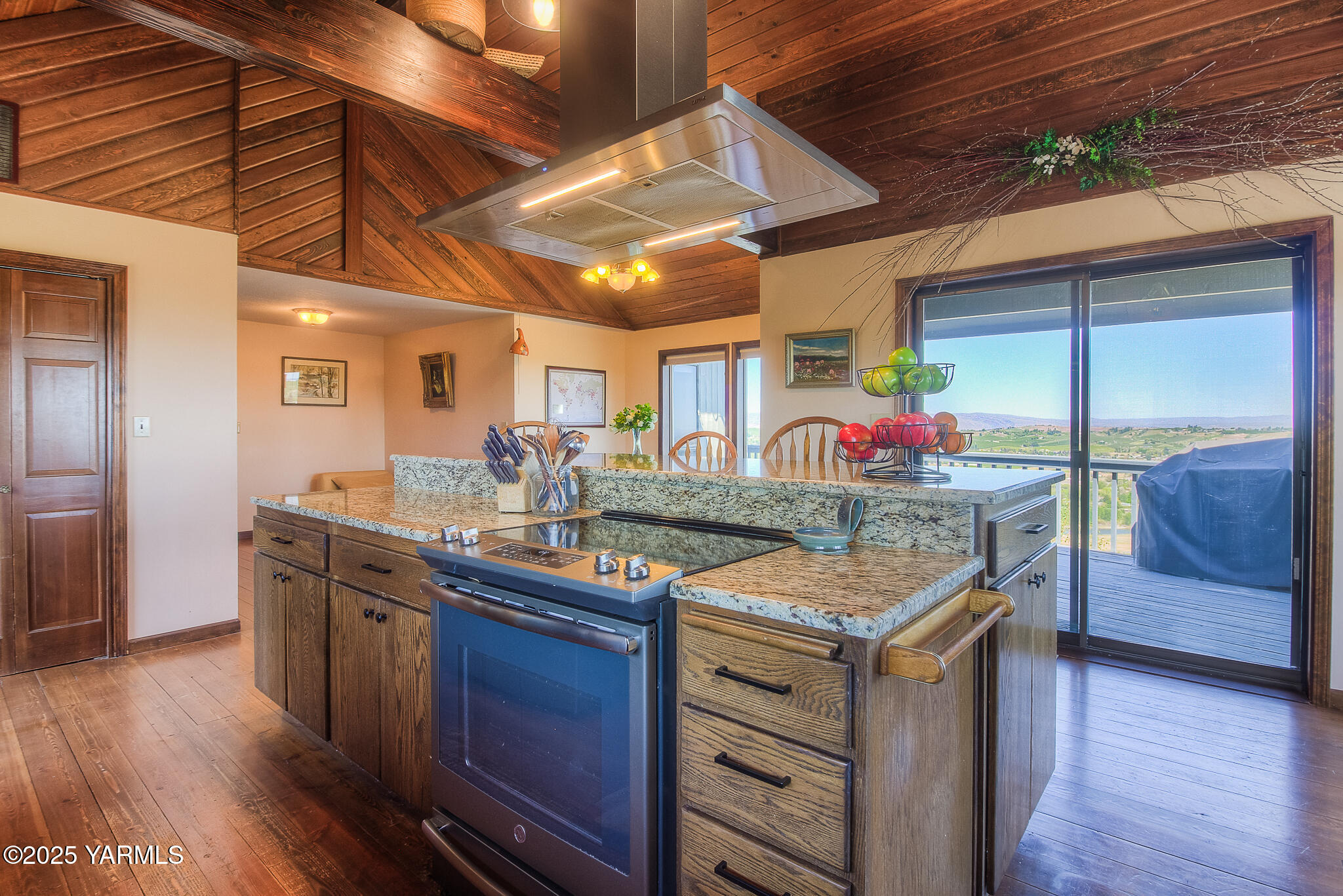 541 Basalt Springs Way Yakima, WA 98908 - Photo 19 of 51 a kitchen with stainless steel appliances granite countertop a stove a sink and a wooden floors