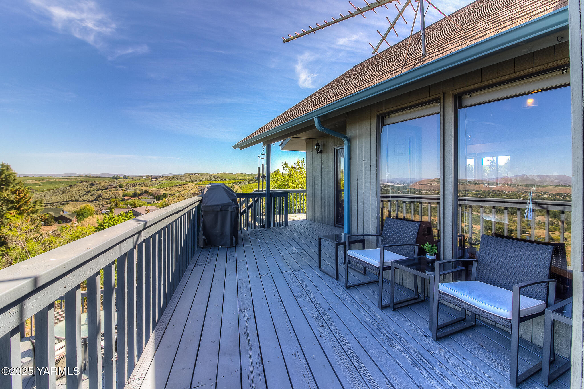 541 Basalt Springs Way Yakima, WA 98908 - Photo 21 of 51 a view of a balcony with furniture and wooden floor
