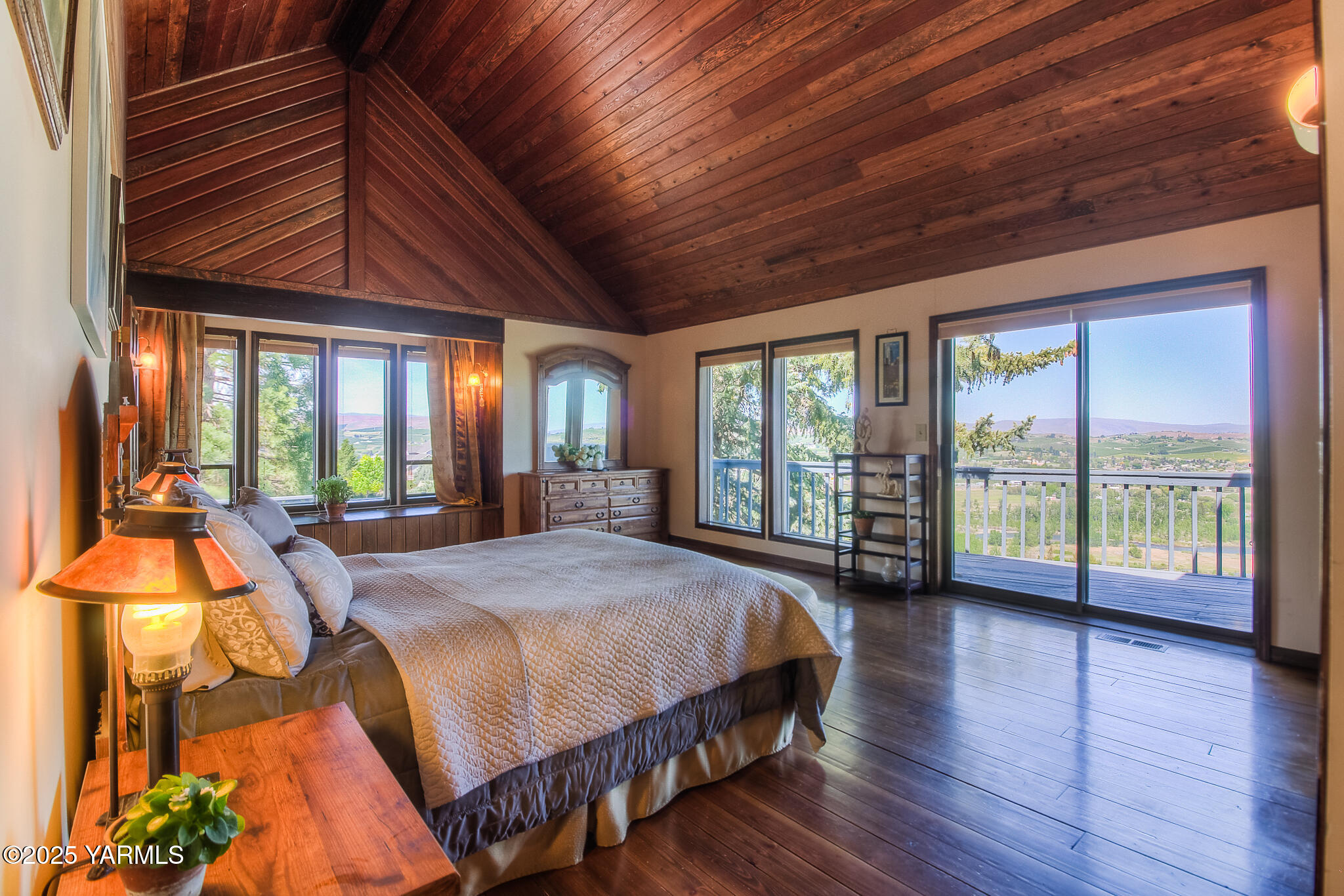 541 Basalt Springs Way Yakima, WA 98908 - Photo 25 of 51 a spacious bedroom with a bed and wooden floor