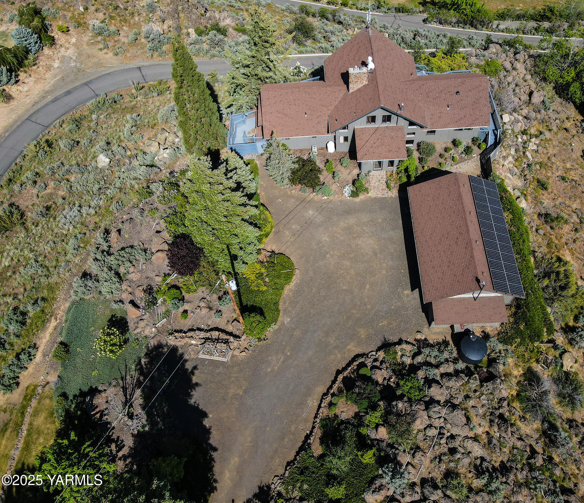 541 Basalt Springs Way Yakima, WA 98908 - Photo 3 of 51 an aerial view of a house with a yard and a garden